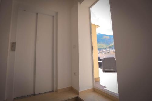 an empty room with a large window in a building at Sciabika Home - Edificio Eolie in Castellammare del Golfo