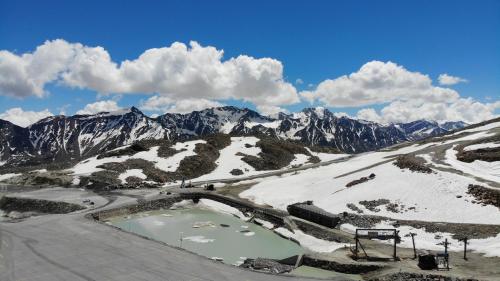 an aerial view of a snow covered mountain with a river at Alpenspirit in Sölden