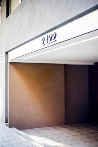 a garage door with the number on it at Top Rentals WOW Nuñez in Buenos Aires