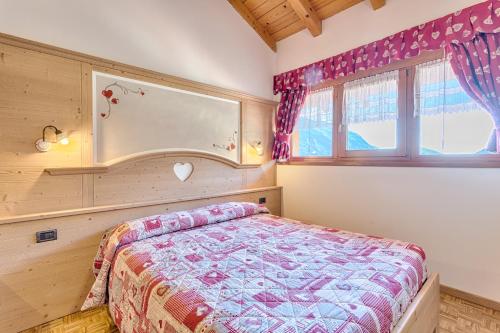 Postel nebo postele na pokoji v ubytování Residence Ronchi