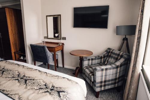 Manor House Hotel & Spa, Alsagerにあるテレビまたはエンターテインメントセンター