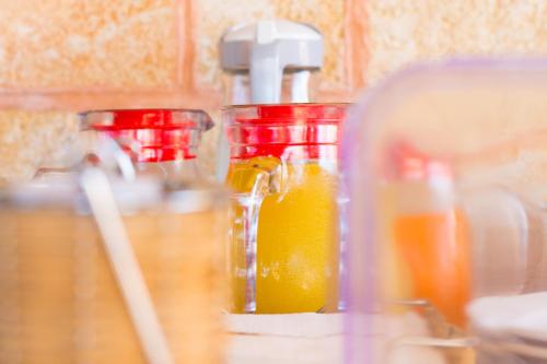 a blender filled with orange juice on top of a counter at Biancolivo Gallipoli in Salento in Gallipoli
