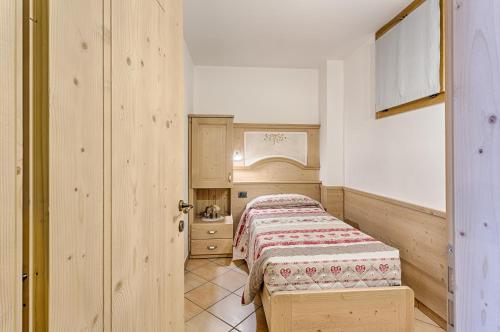 Postel nebo postele na pokoji v ubytování Residence Ronchi