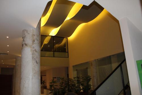 a building with a column in front of it at Hotel Boutique La Toja Campeche in Campeche