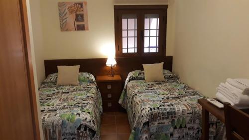 Postel nebo postele na pokoji v ubytování Toledo Magico