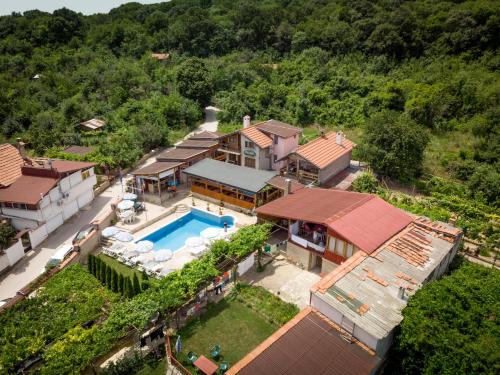 an aerial view of a house with a swimming pool at Hotel Poseidon in Golden Sands