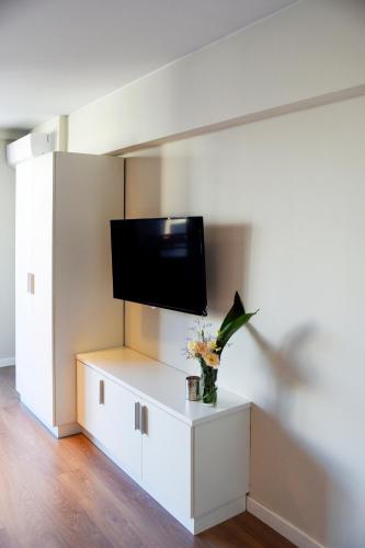 a living room with a tv on a wall at Top Rentals WOW Nuñez in Buenos Aires