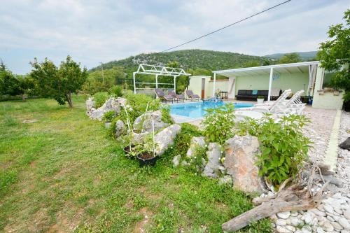 an image of a house with a swimming pool at Villa Iva in Kraj