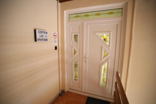 a door with a no entry sign next to it at Centrum Lux 2 Apartmanok in Kaposvár