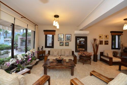 a living room with a couch and a table at Dalyan Resort - Special Category in Dalyan