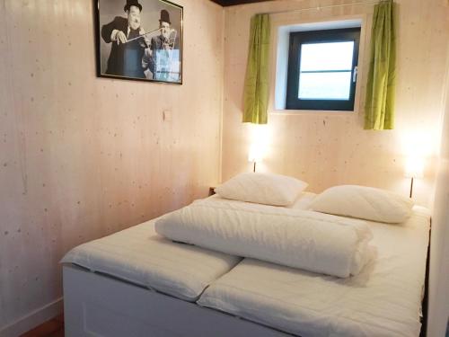 Säng eller sängar i ett rum på Huisje in Stavelot