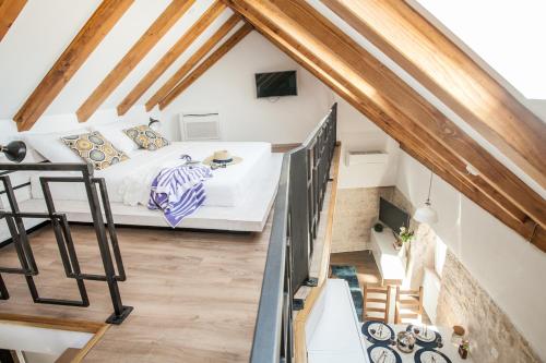 a bedroom with a bed in a attic at Villa Lucia in Trogir