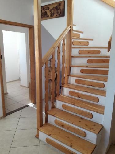 a staircase in a house with wooden treads at Guest House Zuzana in Habovka