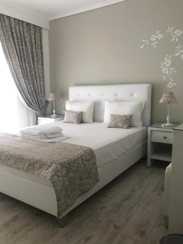 Кровать или кровати в номере Villa Kiza Apartments