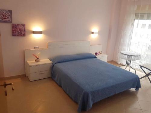 A bed or beds in a room at Villa Sol & Mar
