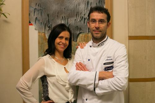 a man and a woman posing for a picture at Hotel Calinferno in Codognè