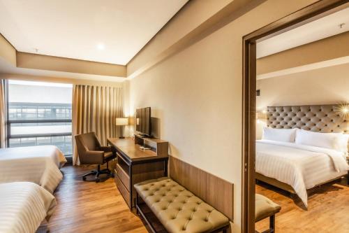 GHL Hotel Bogota Occidente tesisinde bir odada yatak veya yataklar