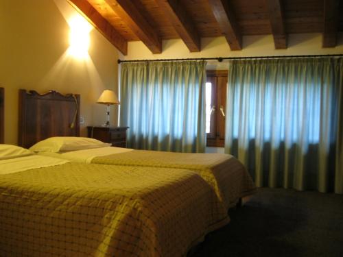 Ένα ή περισσότερα κρεβάτια σε δωμάτιο στο Agriturismo MELO IN FIORE con camere e colazioni nella zona del Prosecco DOCG Asolo