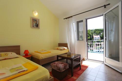 En eller flere senge i et værelse på Seaside Apartments Antičević