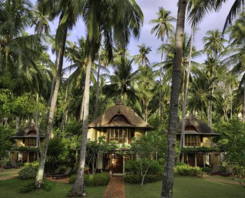 a house in the middle of palm trees at Rayavadee- SHA Extra Plus in Railay Beach
