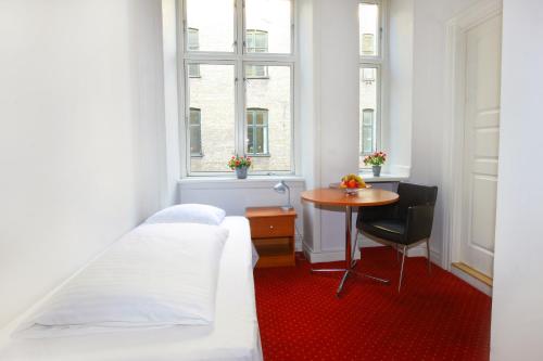Кровать или кровати в номере Hotel Nora Copenhagen