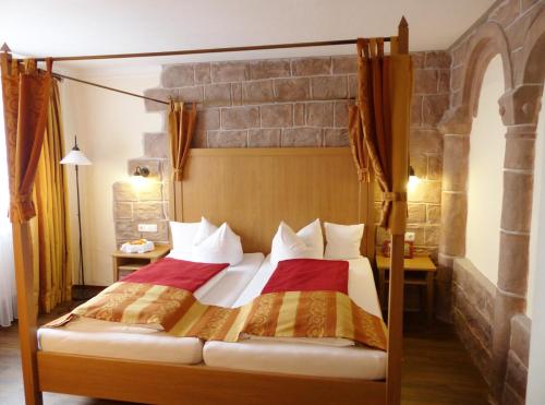 Voodi või voodid majutusasutuse Grimmelshausen Hotel toas