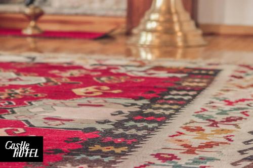 a close up of a rug on a floor at Castle Hotel in Gjirokastër