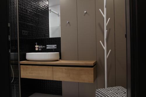 a bathroom with a sink and a mirror at Apartmán 16 Romantika Chopok Juh Tále in Tale