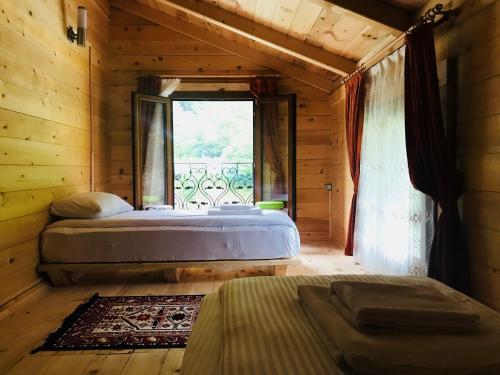 A bed or beds in a room at Aden River