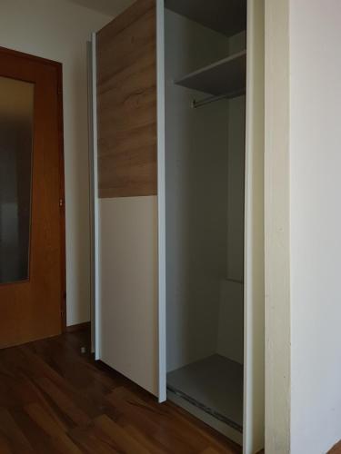 a closet with a glass door in a room at Landgasthof Waldesruh in Gallspach