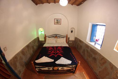 Una cama o camas en una habitación de Palmeraie Guest House