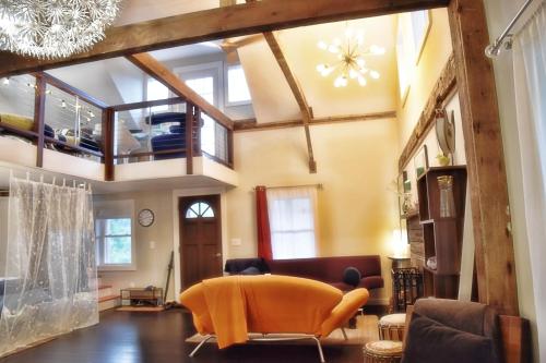 a living room filled with furniture and a chandelier at Romantic, Magical Cottage in Catskills nr Woodstock in Willow
