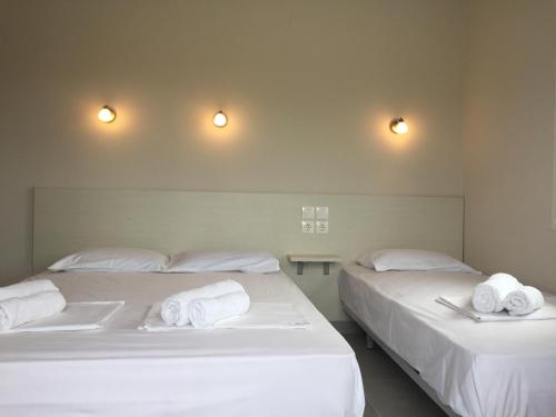 Postel nebo postele na pokoji v ubytování Seaside Apartments Flogita