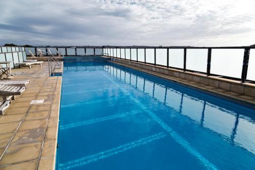 a large swimming pool on top of a building at Picture Perfect Hotel Living in Auckland