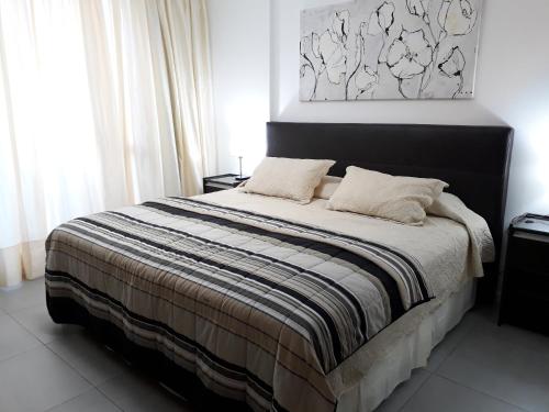 Ένα ή περισσότερα κρεβάτια σε δωμάτιο στο Apartamentos CR