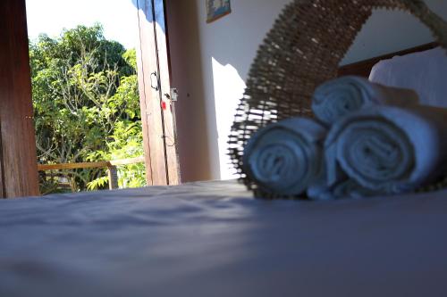 a basket of toilet paper sitting on top of a table at Chale Vista Encantada in Lavras Novas