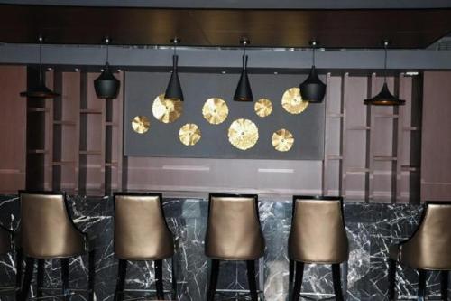 Coin salon dans l'établissement Kiranshree Grand