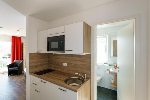 TV a/nebo společenská místnost v ubytování Come IN Hotel