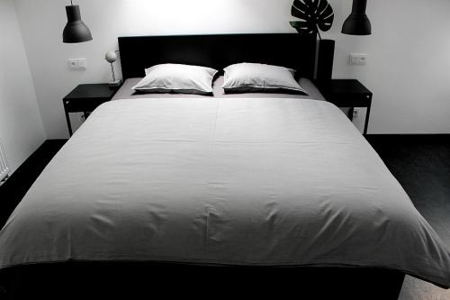 Postel nebo postele na pokoji v ubytování Penzion Vinarstvi Bilkovi