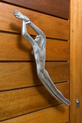a glass animal is hanging on a door at Whale Away Guest House in Hermanus