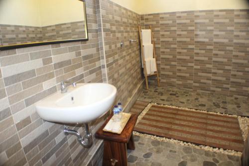 Ванная комната в Telagamas Guest House