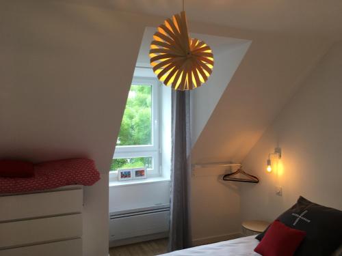 Ένα ή περισσότερα κρεβάτια σε δωμάτιο στο LA VILLE A LA MER N°3