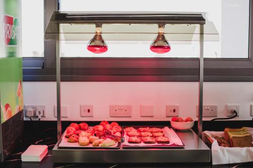 a kitchen with a bunch of food on a counter at Frangiorgio Hotel in Larnaka