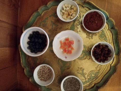 a plate with bowls of food on a table at Il Silos in Maccarese