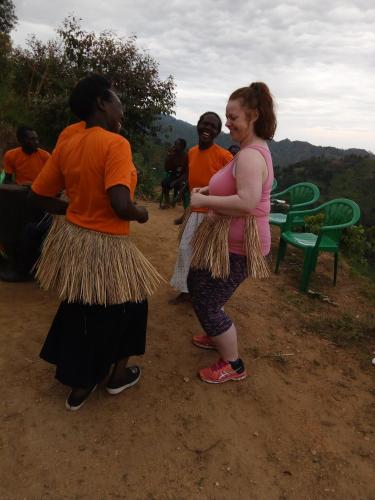 a group of women standing next to each other at Mbunga Community Tourism Campsite in Kasese