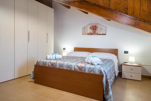 a bedroom with a bed in a room at Casa Vacanze Un Tuffo Nel Blu in Matera