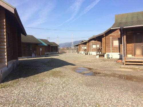 a group of buildings with a driveway between them at 美濃田の淵キャンプ村 in Higashimiyoshi