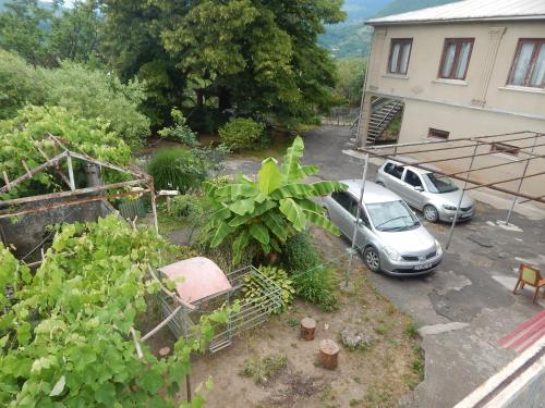 a car parked in a parking lot next to a building at Savanna House Jvari in Jvari