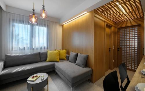 a living room with a couch and a table at Castristudios in Nikiti