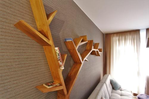 a room with wooden shelves on the wall at Zlatý Apartmán, Granit 106 in Vysoke Tatry - Tatranska Lomnica.
